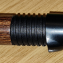 Wooden body, graphite thread, black hoods + rubber button